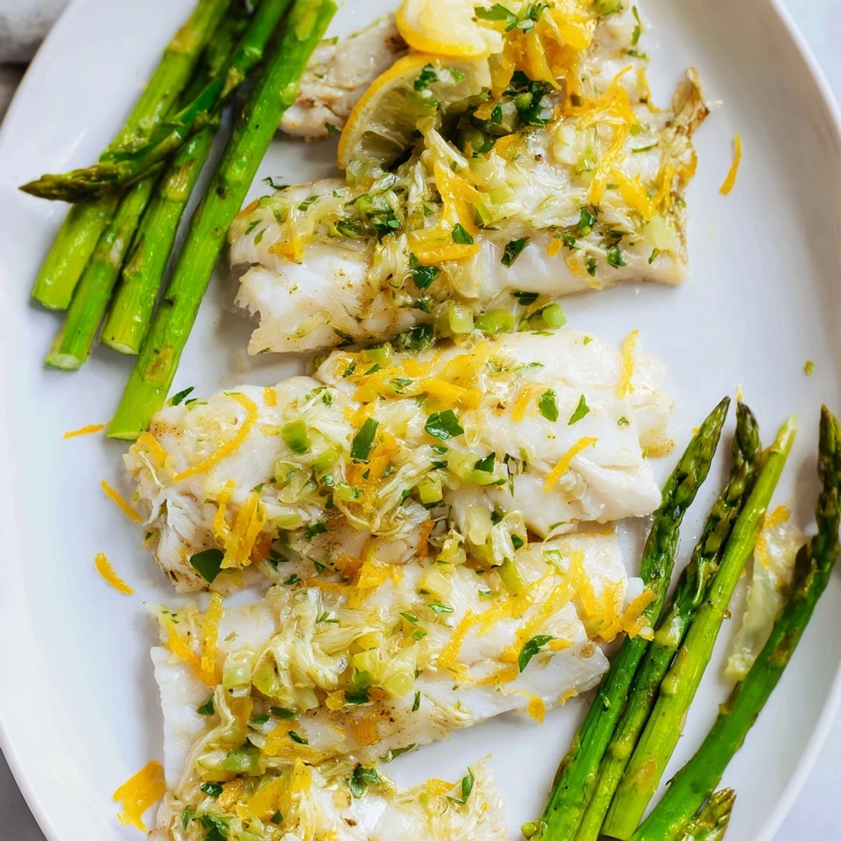 Golden-brown baked sheet pan lemon herb tilapia, perfectly cooked with vibrant green beans.
