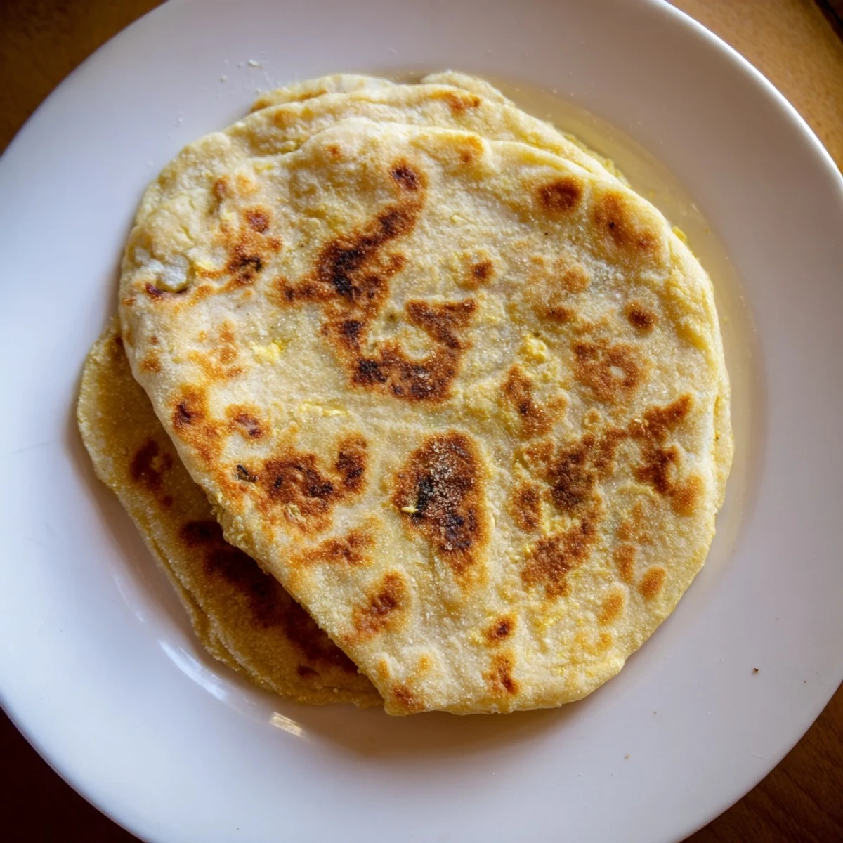 Warm Cottage Cheese Flatbread, smelling savory and cooked to a perfect, lightly charred texture, ideal for serving.