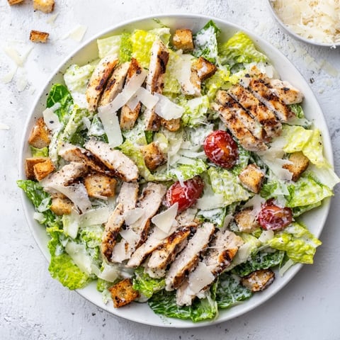 Juicy grilled chicken strips over crisp romaine lettuce in this refreshing Yogurt Caesar Grilled Chicken Salad, drizzled with creamy Greek yogurt dressing. 