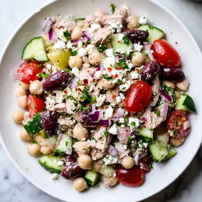 Enjoy a delicious and easy Tuna Chickpea Salad, perfect for a quick and healthy lunch option.