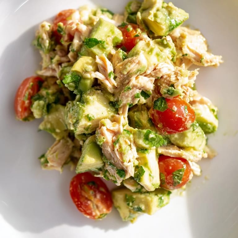 Healthy Avocado Chicken Salad with tender chicken, crisp cucumber, and herbs, ready to enjoy.