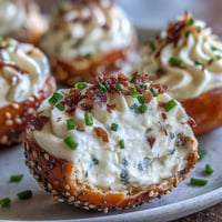 Everything Bagel Deviled Eggs with Cream Cheese, topped with crunchy seasoning.